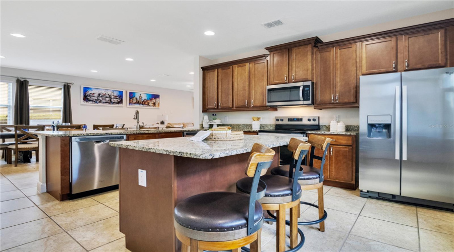 Stainless Steel Appliances, Two Dishwashers, and Island Seating make entertaining a breeze