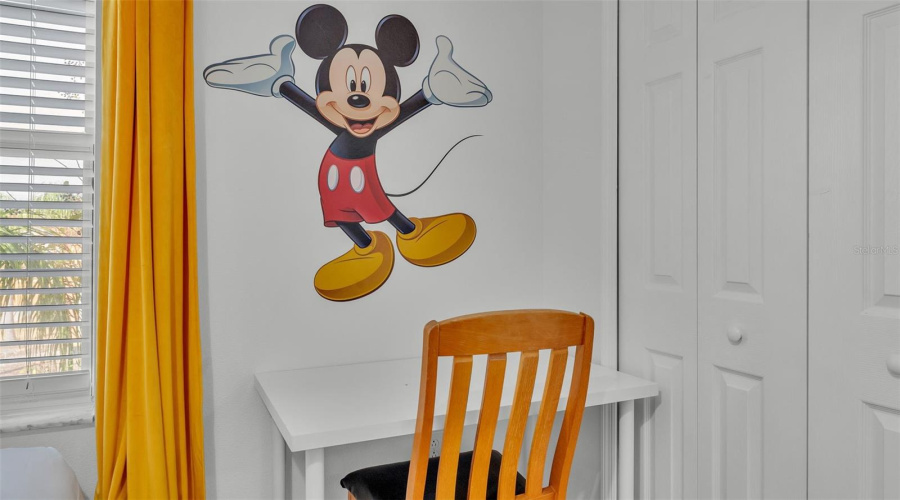 Mickey Mouse welcomes you in bedroom 2.