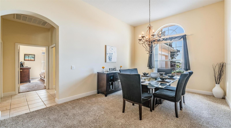 The formal dining room is located immediately to the right upon entering.