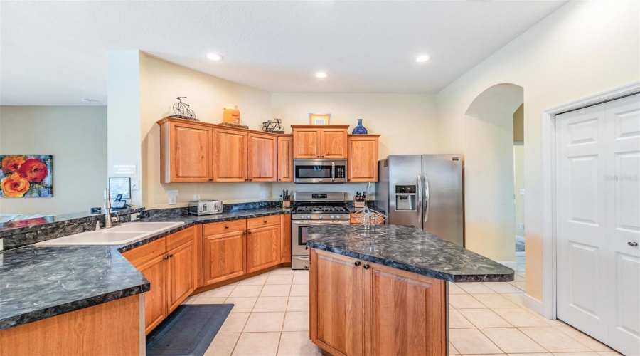A spacious island and abundant counter space make meal prep and entertaining a breeze.