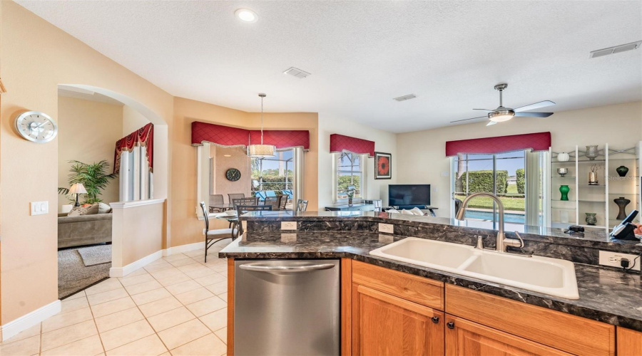 Large windows throughout the kitchen and great room invite an abundance of natural light.