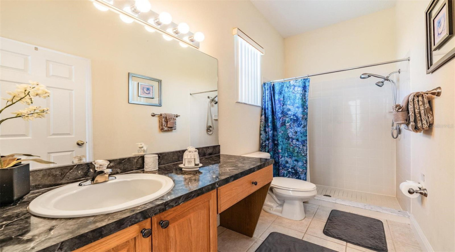 Designed with comfort in mind, the en-suite bath off the 5th bedroom includes a step-in shower for added safety.