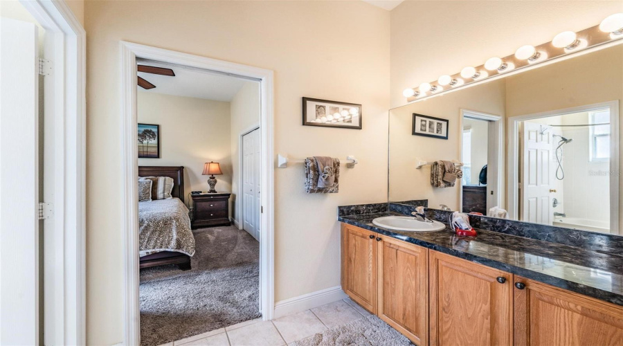 A Jack-and-Jill bathroom connects the third bedroom with the fourth, creating a practical and private layout