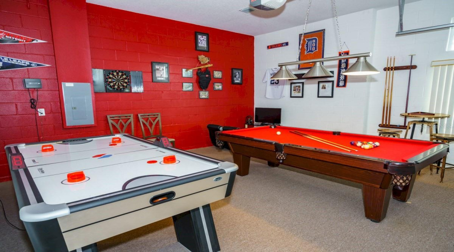 Configured for enjoyment, the garage is set up as a fun zone for both kids and adults.