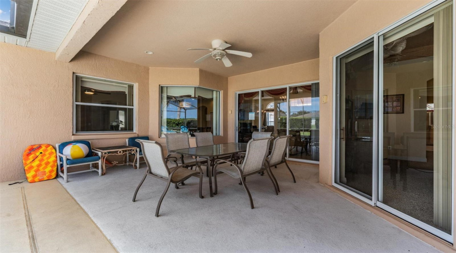 The covered patio/lanai provides the perfect space to relax or entertain, no matter the weather.