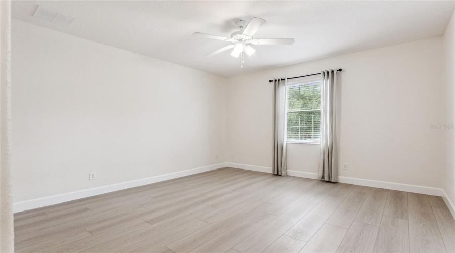 Bright second bedroom with private ensuite bathroom for added comfort and convenience.