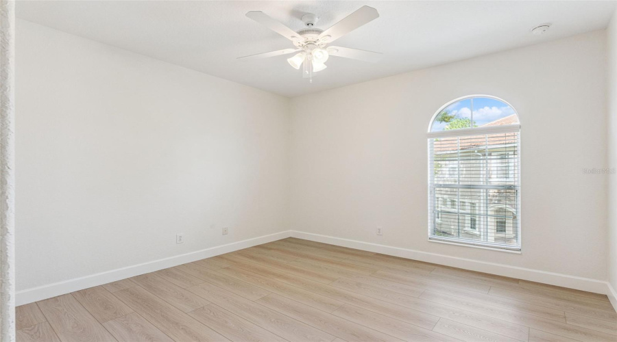 Bedroom 3 features a closet with built-in shelving and custom organization.