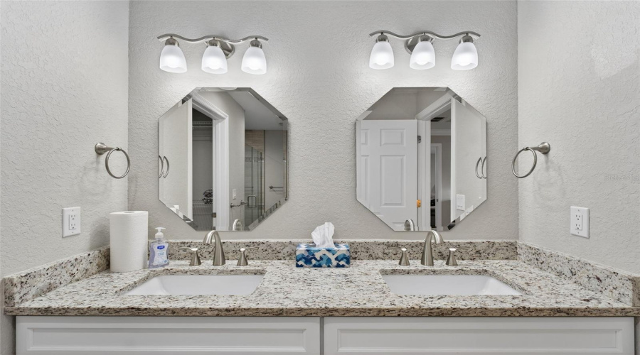 Primary Bath:Modern finishes with walk-in shower and updated fixtures.