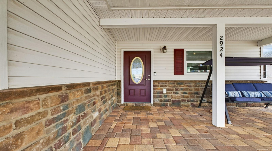 Front Patio: Welcoming front patio, perfect for morning coffee or greeting neighbors.