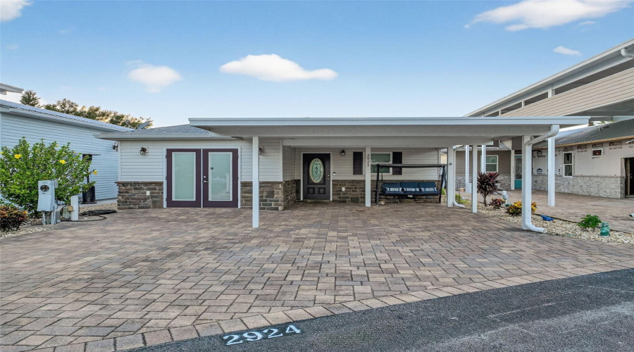 Front Exterior: Welcome to your 2020 home in the gated Deer Creek Golf & RV Community - clean, modern curb appeal.