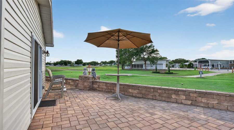 Back Patio: Spacious rear patio with room for outdoor dining and lounging.