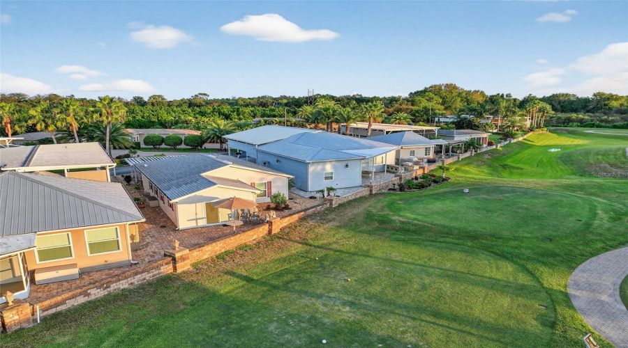 Wide aerial view showcases the home’s position within the Deer Creek community.