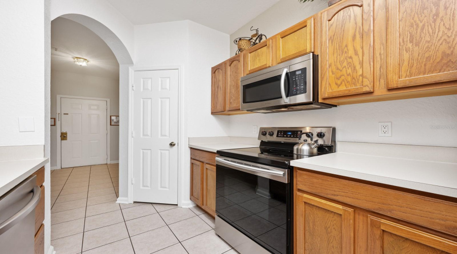 The Kitchen features abundant cabinet storage and counter space, perfect for everyday use or entertaining.