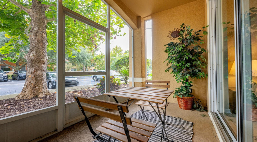 A private, covered, screened patio provides a quiet spot to relax after a day of fun.