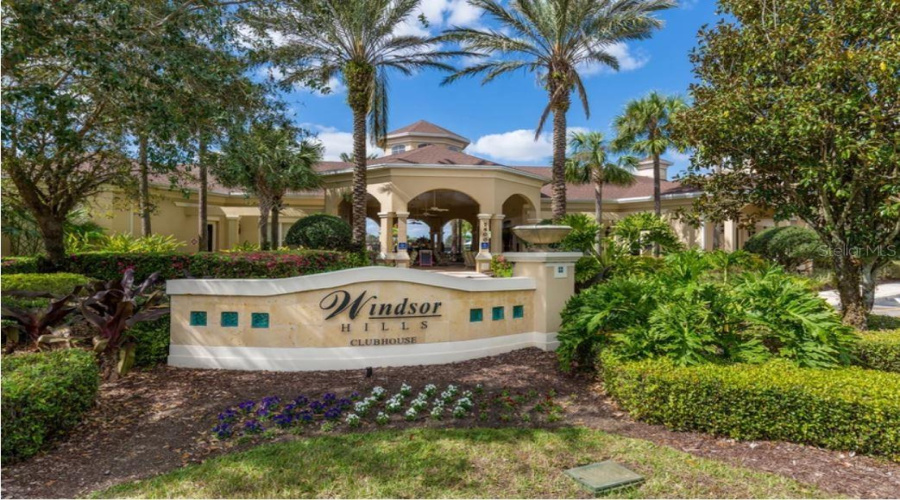 Residents and guests enjoy a resort-style pool, waterslides, splash pad, hot tub, fitness center, arcade, movie theater, sports courts, playgrounds, and clubhouse, along with on-site dining and convenience options.