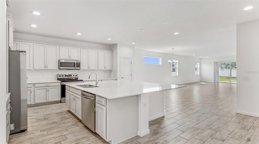 Kitchen opens to dining and living area