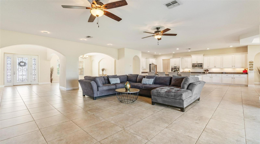 The spacious family room opens up to the gourmet kitchen and formal dining room making this the ideal floor plan for entertaining your guests