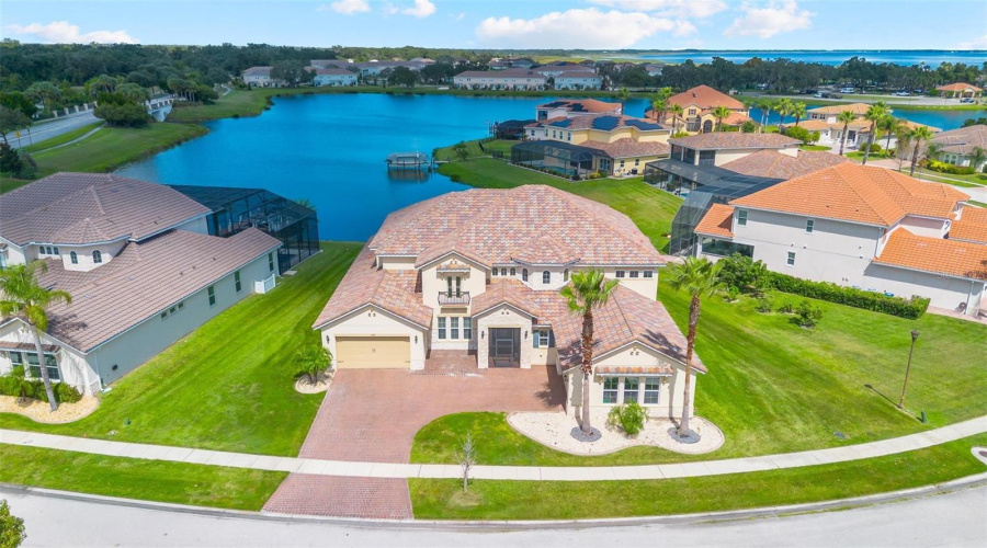 Welcome home to your lakefront estate in guard gated Bellalago located on the pristine shores of Lake Tohopekaliga of the Kissimmee chain of lakes.
