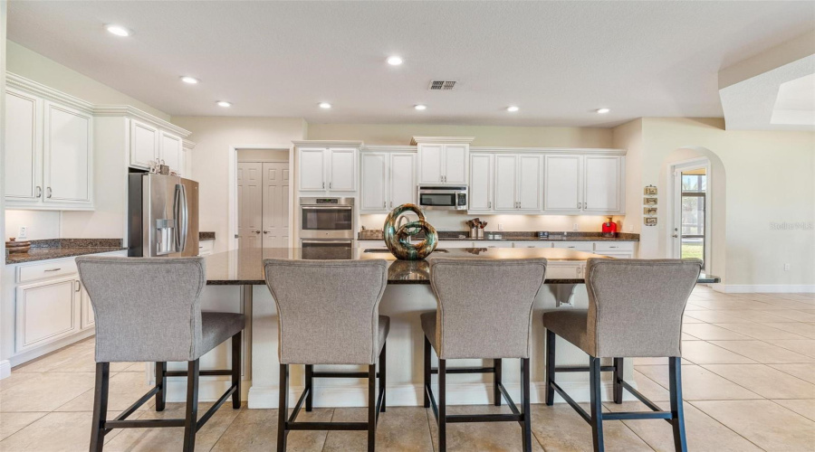 The oversized island and breakfast bar are ideal to prepare and serve guests your favorite culinary creations.