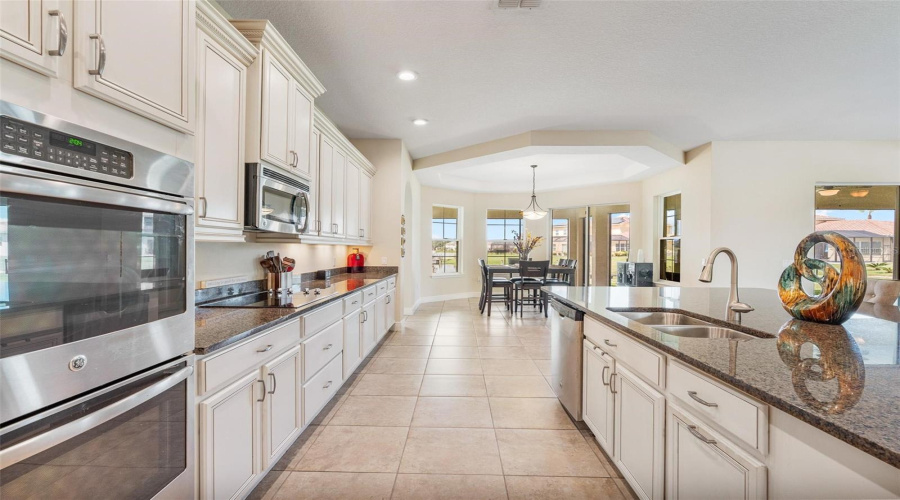 Your gourmet kitchen is a chef's dream come true and is well equipped with upgraded stainless steel appliances and double ovens.