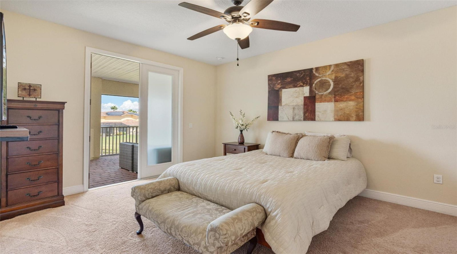 Bedroom 5 with walk-in closet and access to the 2nd floor screened balcony.