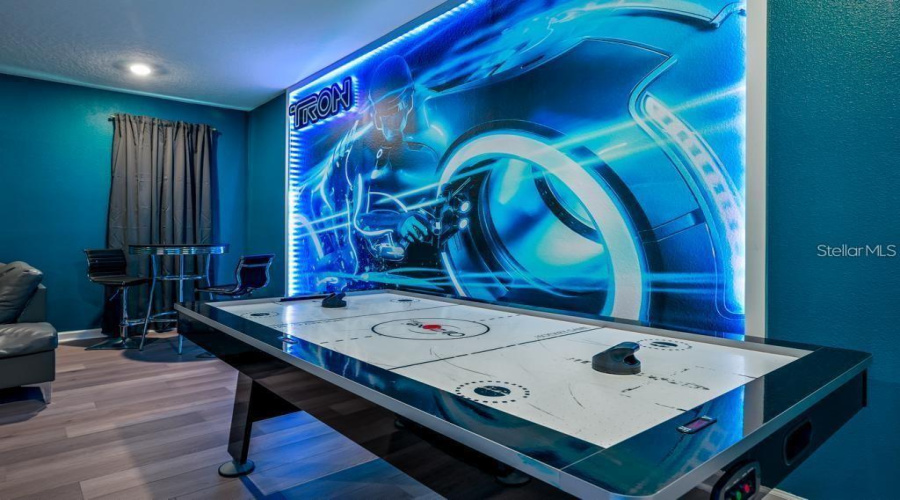 Recreation Room: Oversized entertainment/game room (24’ × 23’), designed for  games, and quality time together.