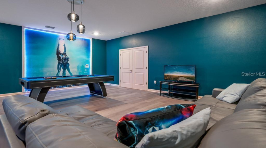 Recreation Room: Oversized entertainment/game room (24’ × 23’), designed for  games, and quality time together.