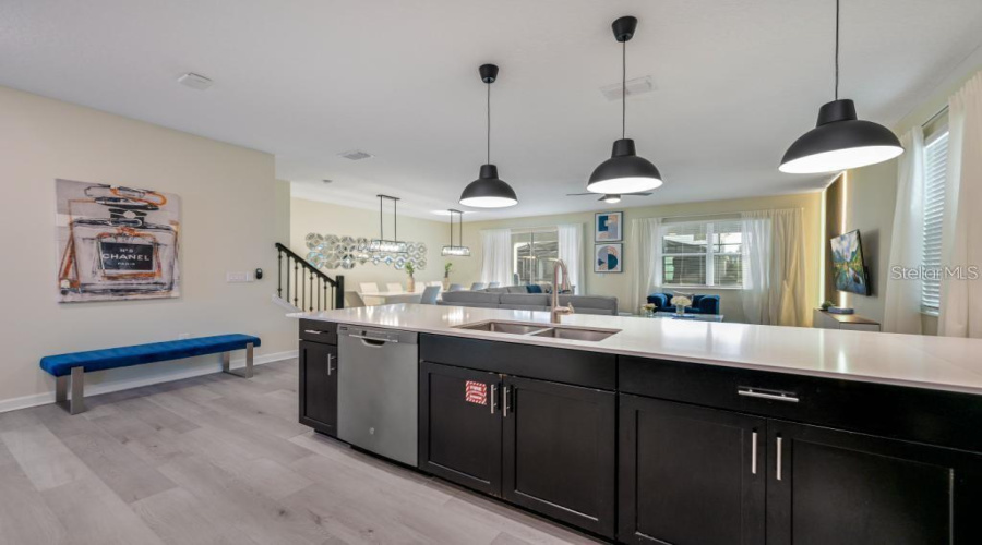 Kitchen: Open concept with central island, connected to the Family Room and Dining Room