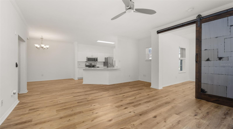 Living Space looking at Barn Door to Den/Bedroom 3