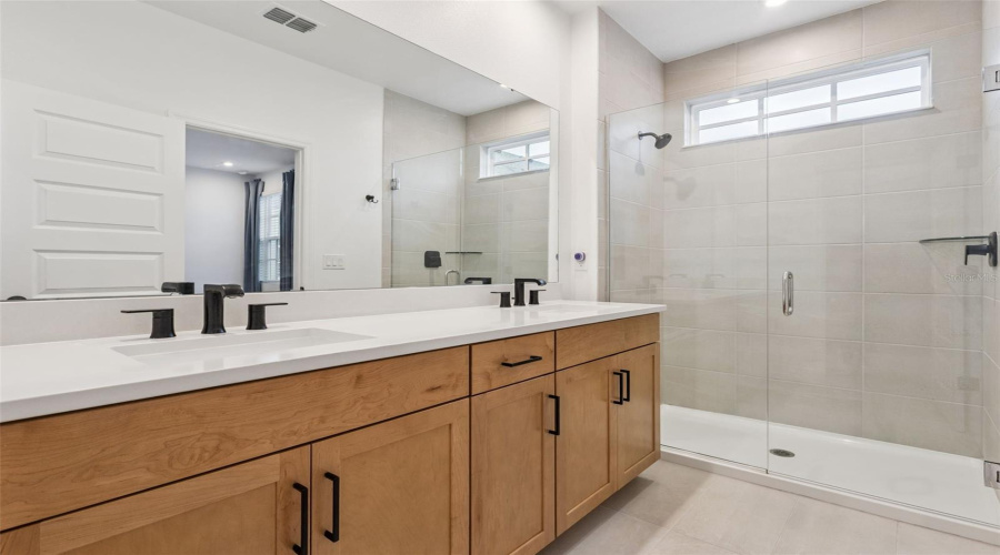 Primary Bathroom with frameless Glass enclosed shower