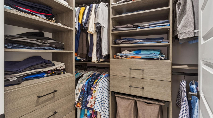Primary Suite has double walk-in closets with Custom California Closet systems