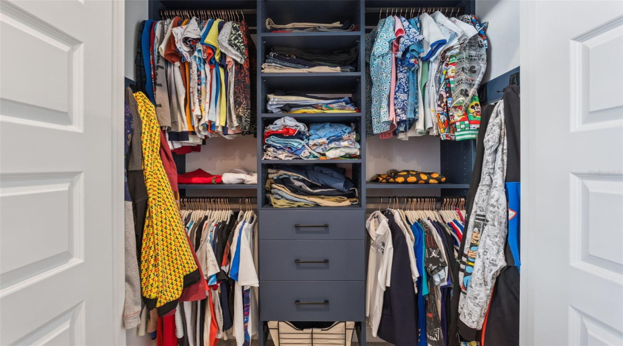 Bedroom 2 closet with custom built-ins