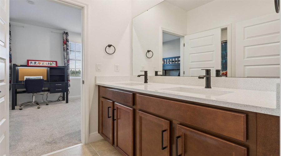 Jack & Jill Bathroom connecting the 2 secondary bedrooms has double sinks