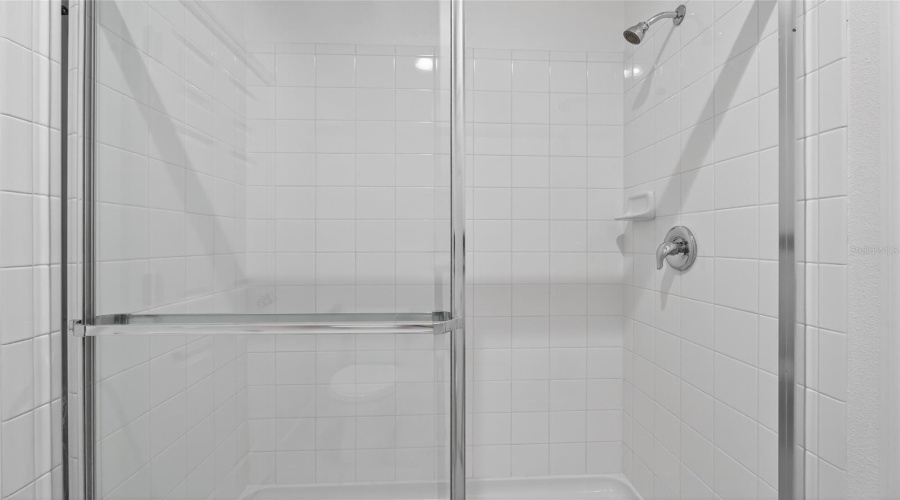 Shower in shared bathroom between bedroom 4 and 5