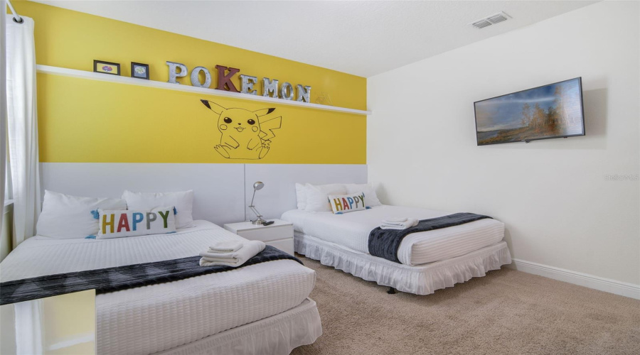 A vibrant Pokémon-themed Bedroom 4 adds a touch of fun and whimsy, perfect for kids or the young at heart.
