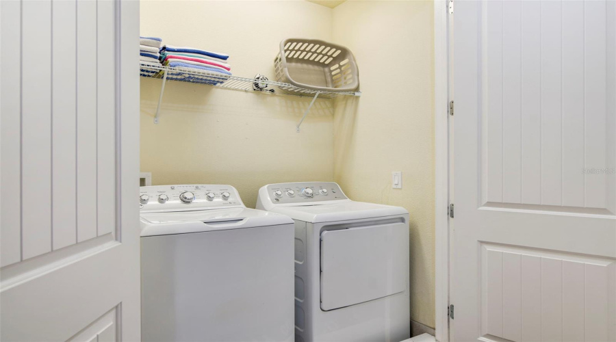 Upstairs, a laundry closet adds everyday convenience.