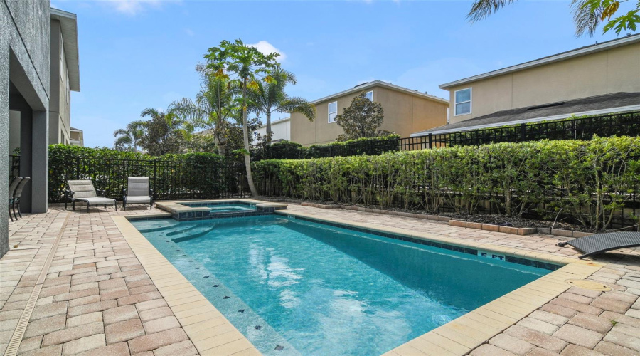 Enjoy your own PRIVATE POOL AND SPA surrounded by a spacious paver patio.