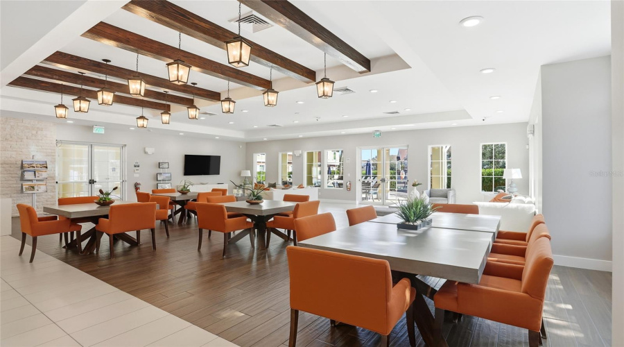 Club house with doors out to the pool