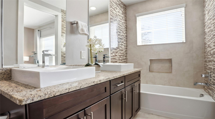 Bathroom 1 also includes a shower