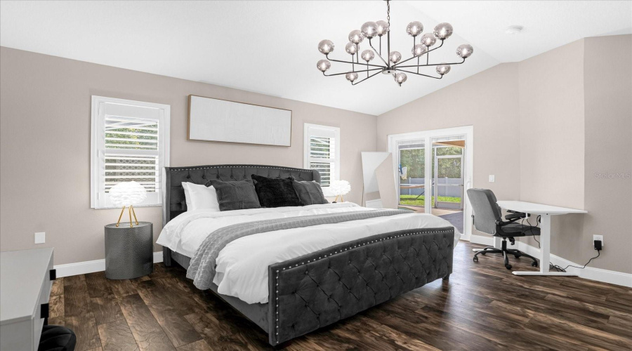 primary bedroom with king size bed