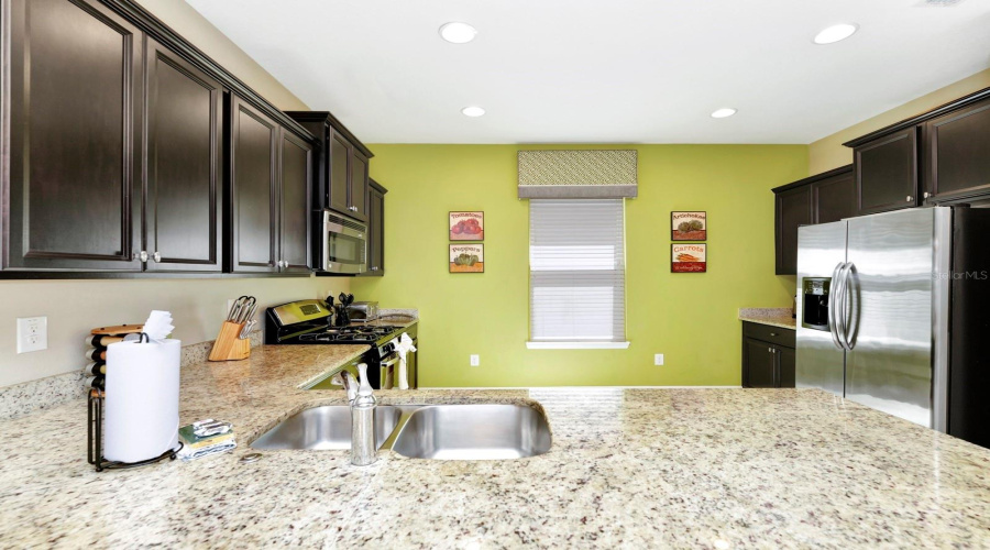 "Updated Kitchen – Granite Countertops, Stainless Steel Appliances, and Ample Storage