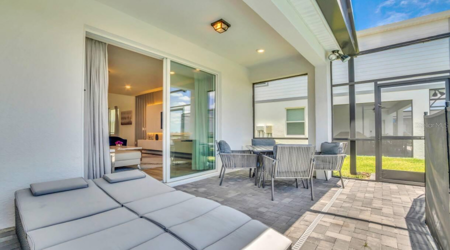 Living Room Opens to Lanai and Pool