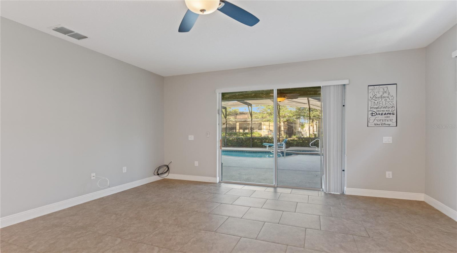living room overlooks the pool and screened patio