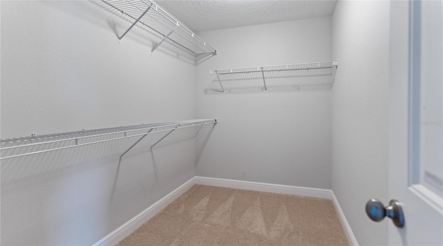 large walk in closet in upstairs primary