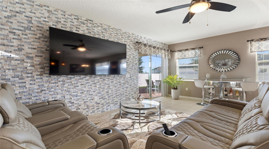 Great room with decorative stone wall Great room with decorative stone wall