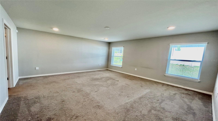 Primary Bedroom located in the back of the house Primary Bedroom located in the back of the house