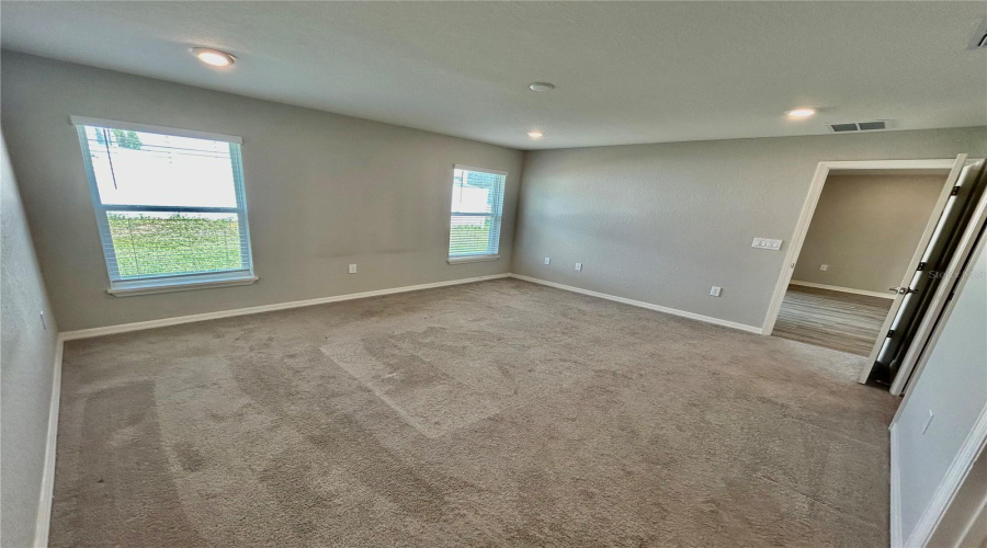 Primary Bedroom located in the back of the house Primary Bedroom located in the back of the house