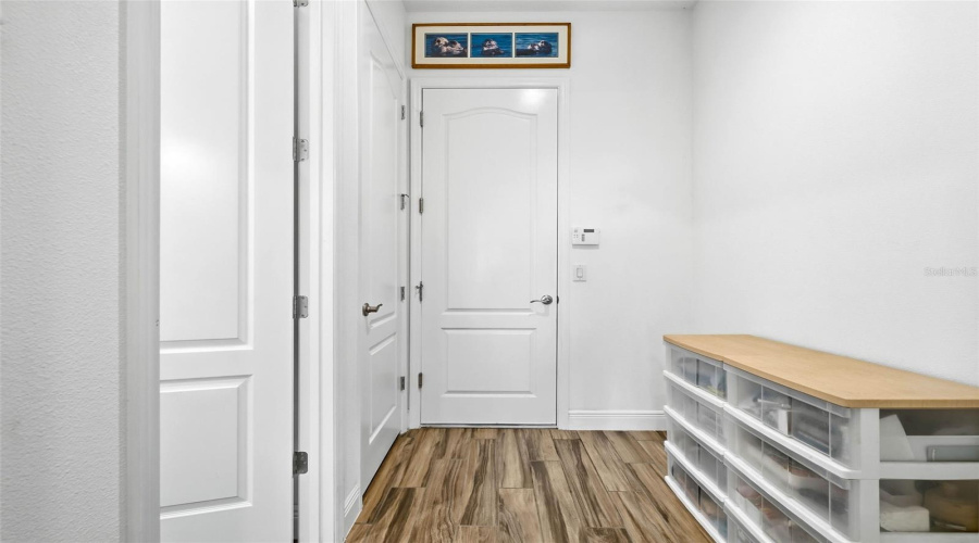 Drop zone coming in from the garage with the laundry room to the left.