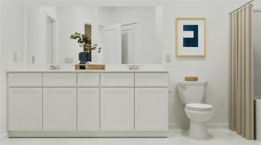 Virtually staged. Main bathroom suite