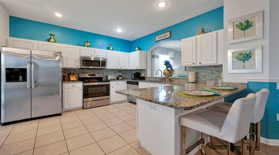 Kitchen, new backsplash, appliances,  granite counter and cabinets resurfaced